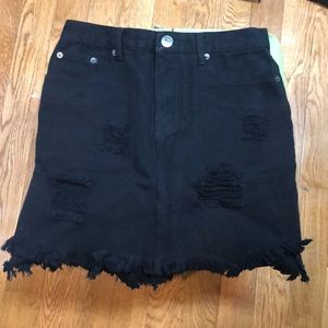 Black distressed denim skirt